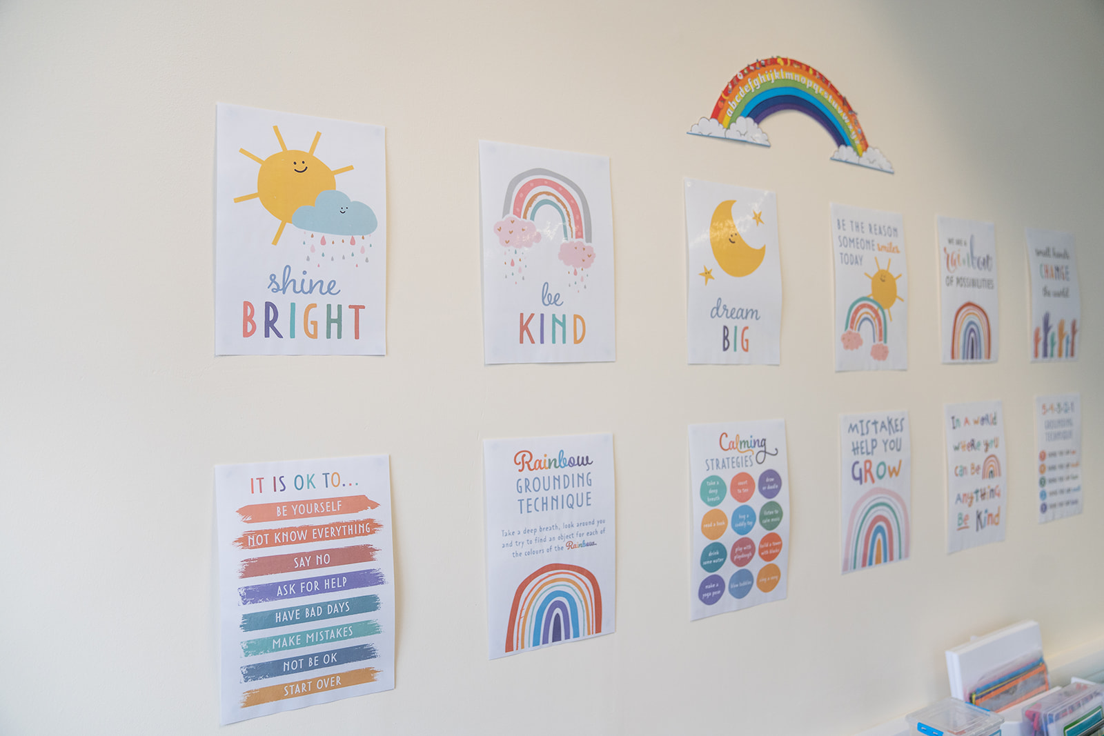 A wall in ls tuition dedicated to self care in the learning space including signs that say to shine bright, be kind and dream big