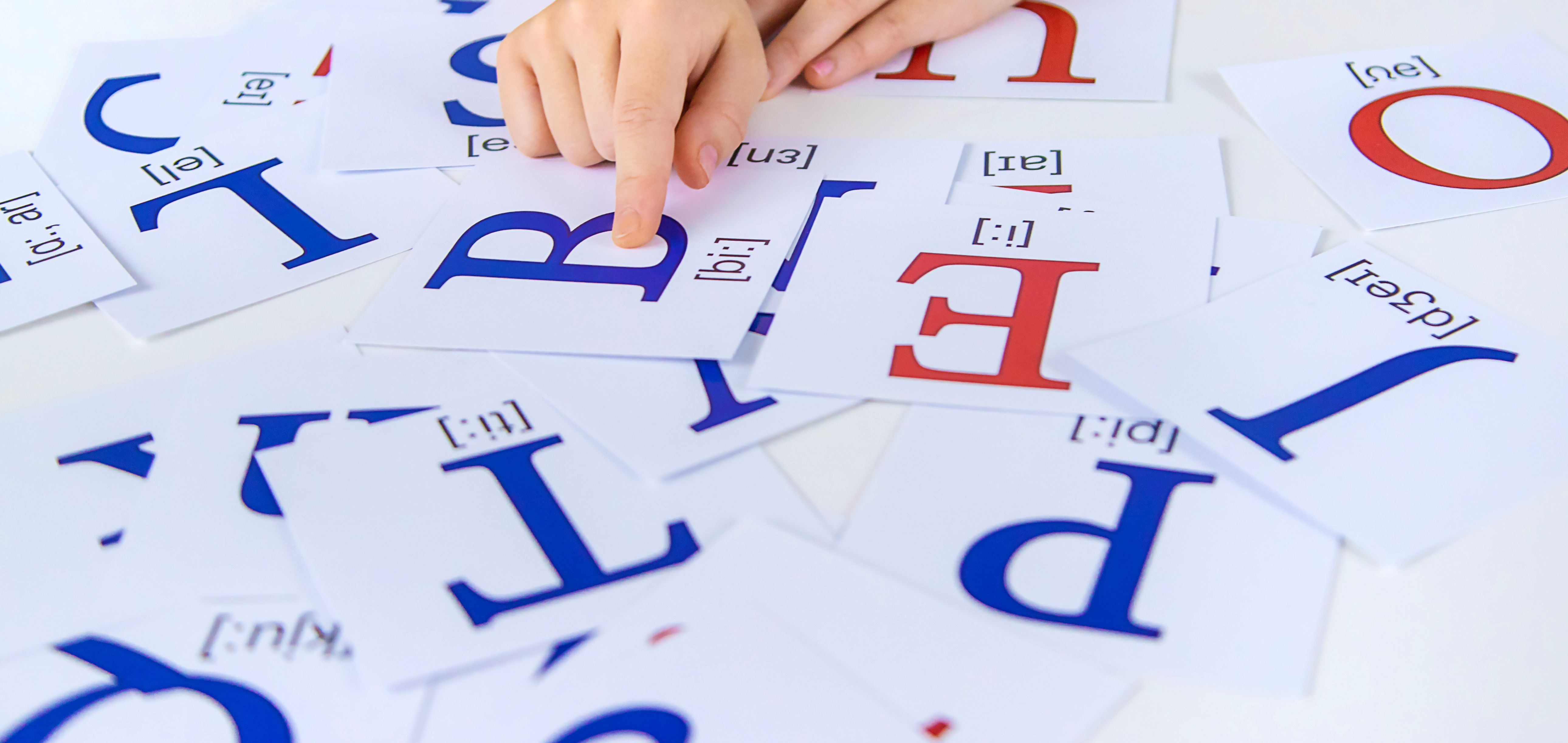 The child learns English letters and phonics