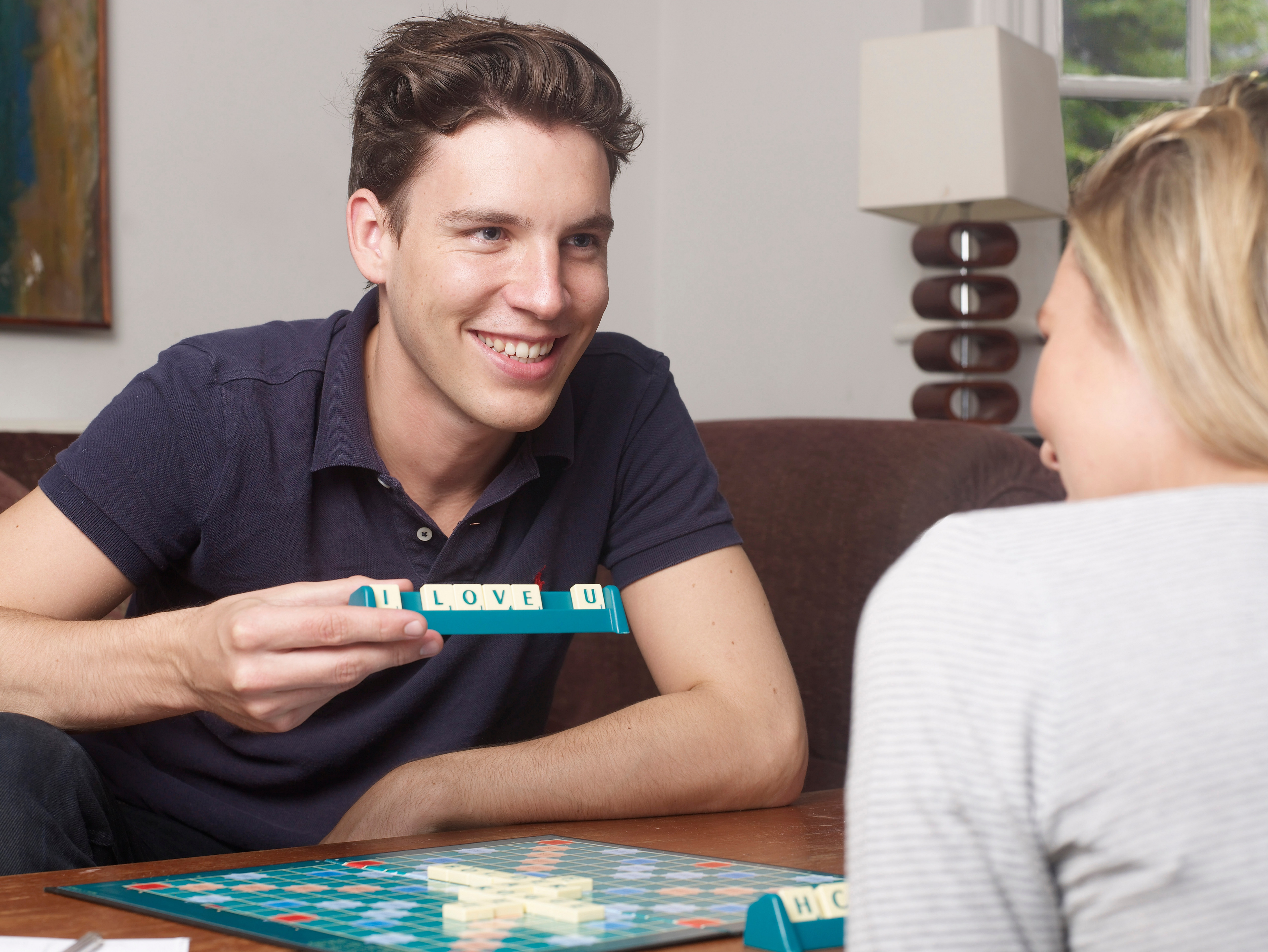 Couple playing scrabble together