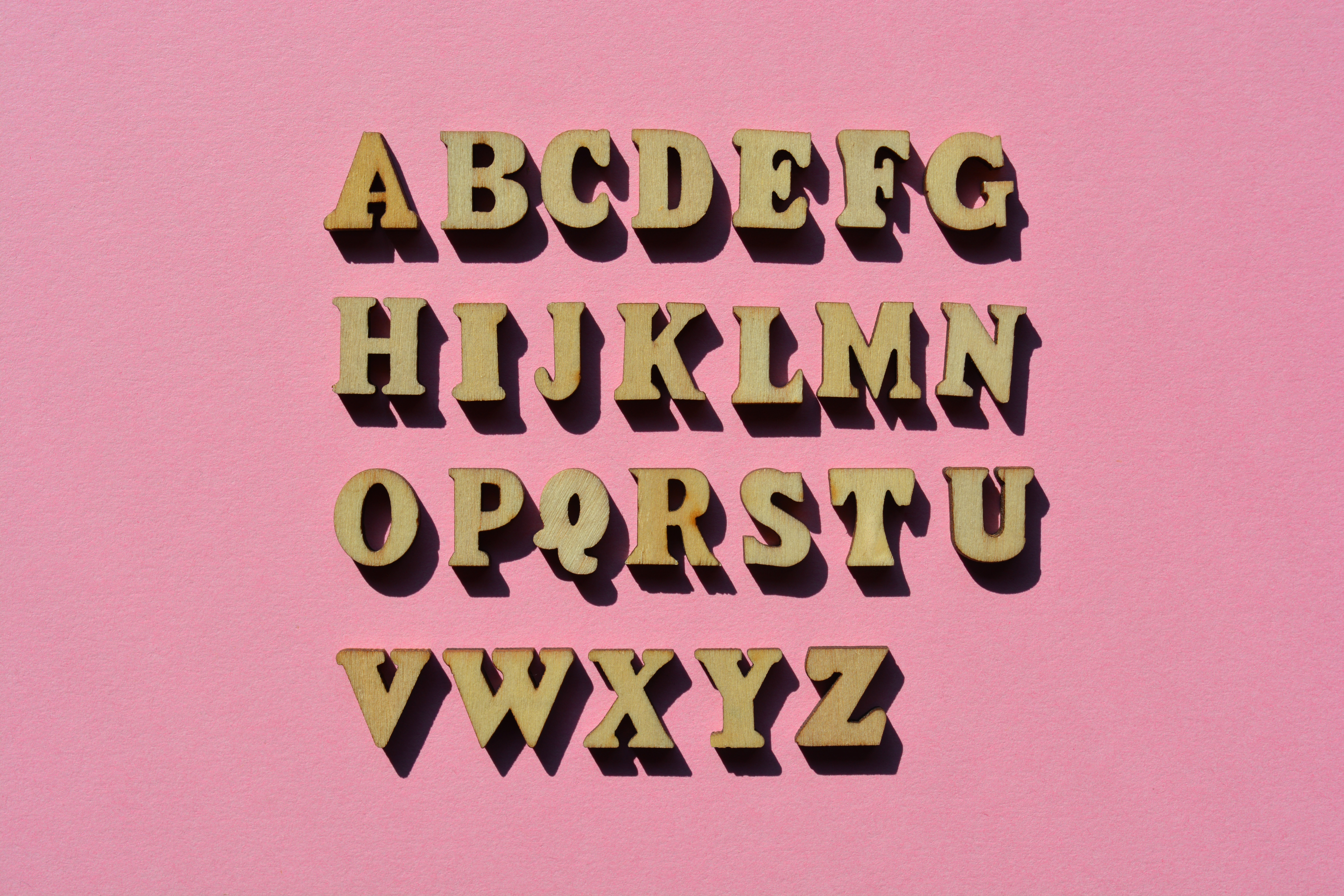 Letters of the alphabet, A to Z isolated on pink background