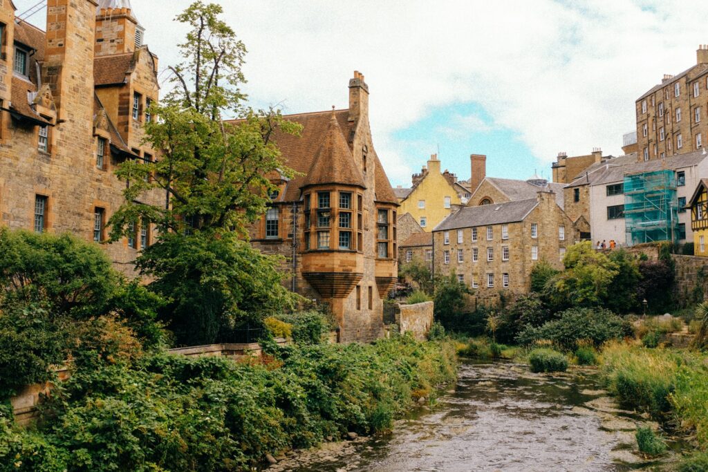 Stream running through historic buildings in Edinburgh